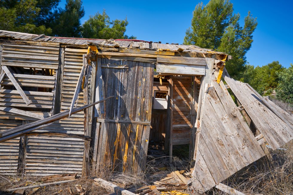 Old wooden cabin house destroyed by hurricane